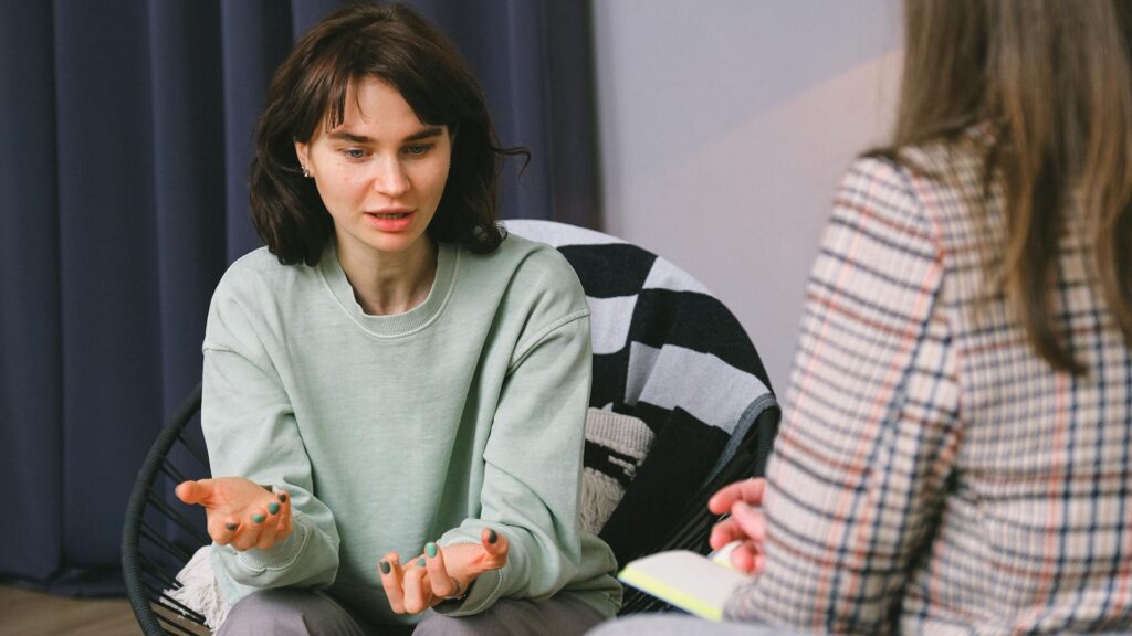Woman speaks in therapy.