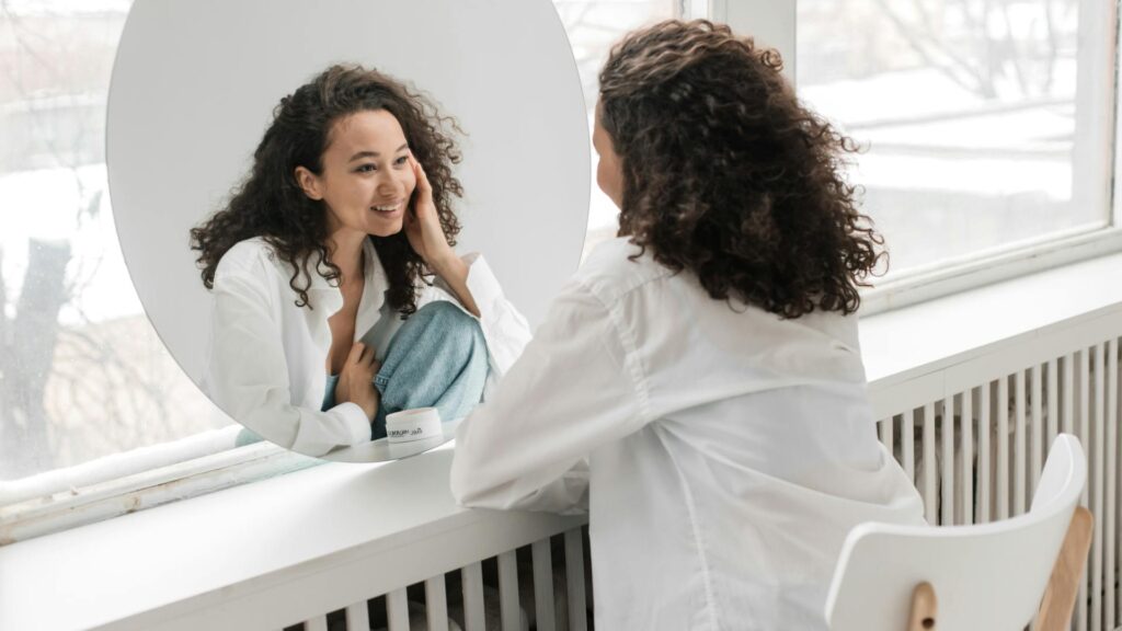 Woman looking at her reflection.