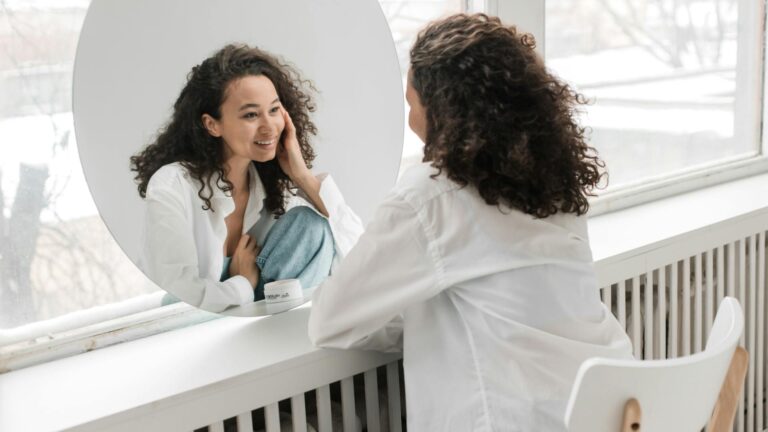 Woman looking at her reflection.