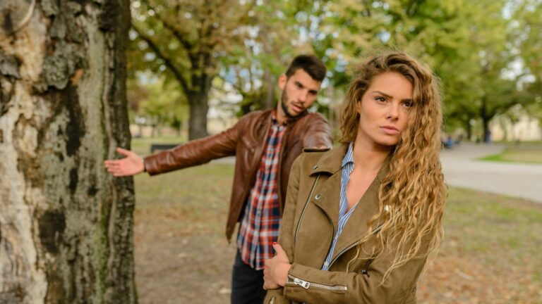 Woman walks away from argument with a man.