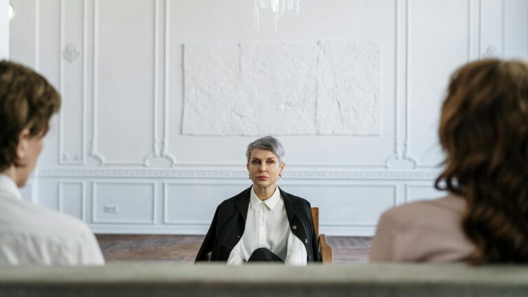 Therapist looks at clients.
